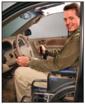 Person using wheelchair in car