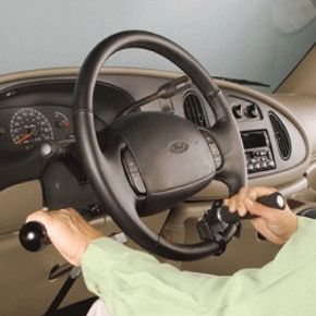 Vehicle steering with adaptive hand controls