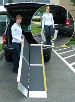 Woman setting up portable wheelchair ramp.