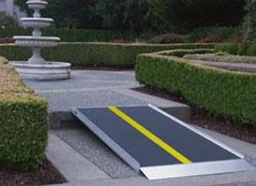 Garden pathway with a ramp and fountain.
