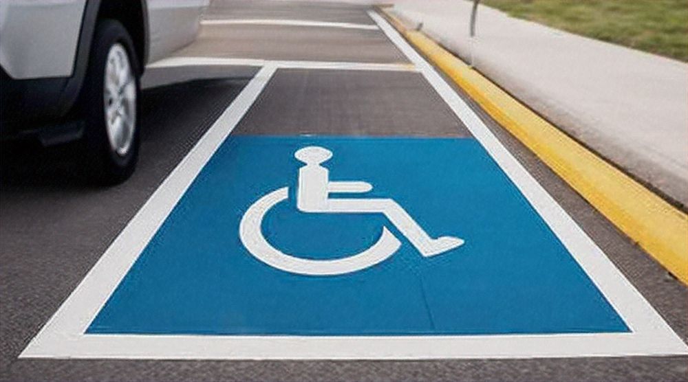 Handicap parking spot next to sidewalk