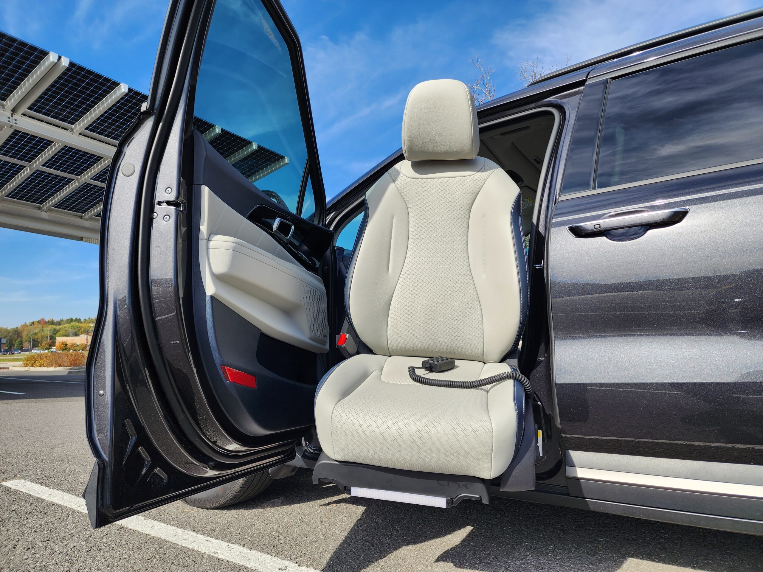Car seat swiveling out for easy access.