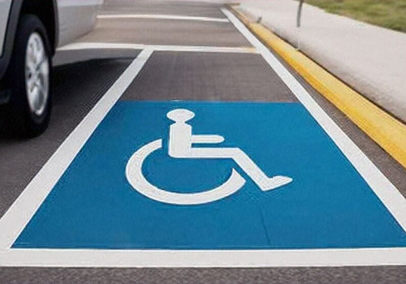 Handicap parking spot next to sidewalk