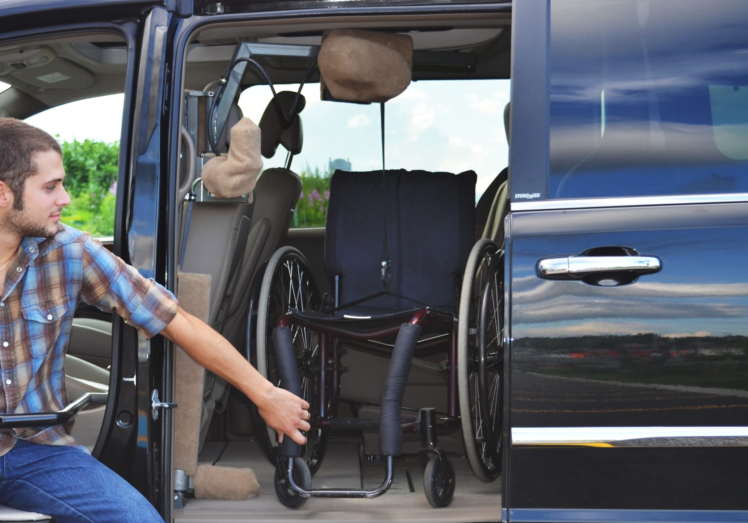 Wheelchair accessible van with door open showing interior space.
