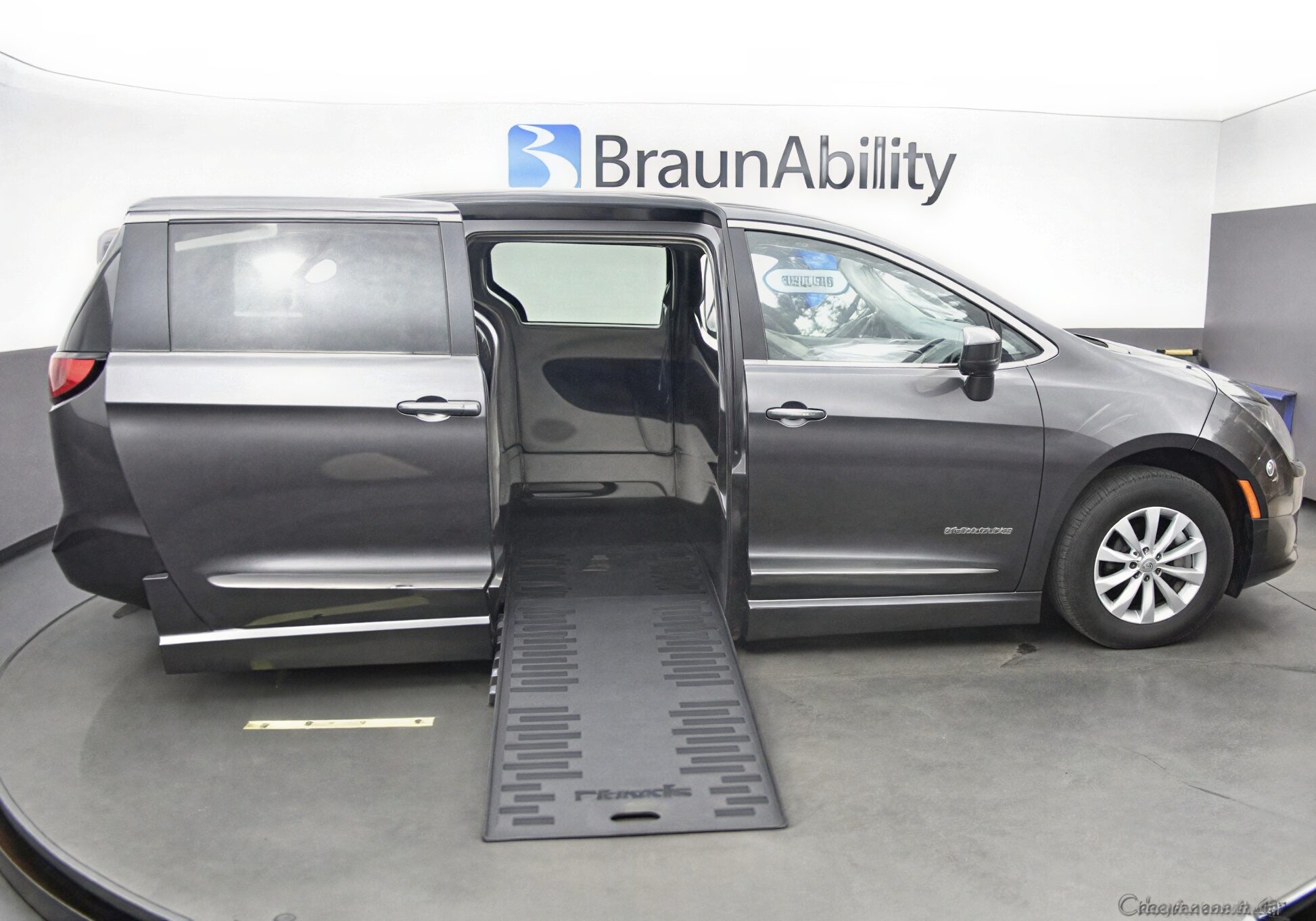 A wheelchair-accessible van with an extended ramp for easy entry.